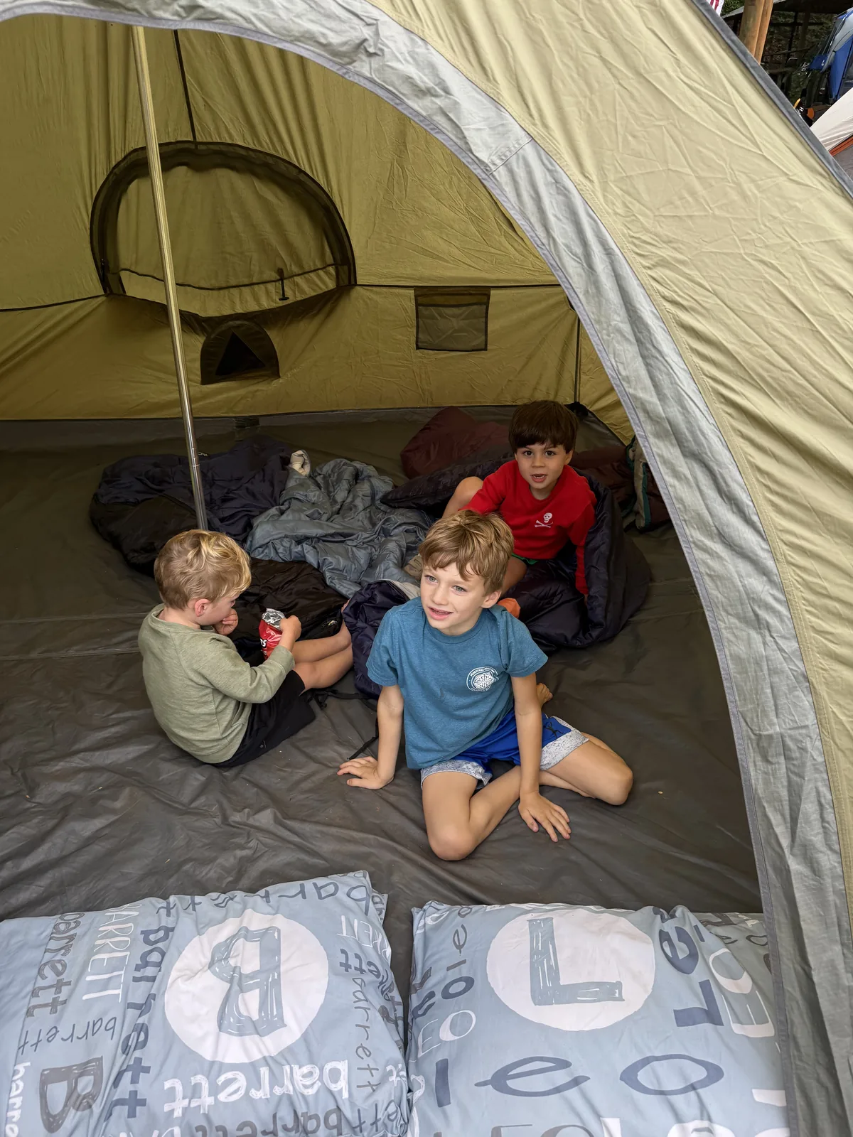 Leo and his brothers camping in a tent